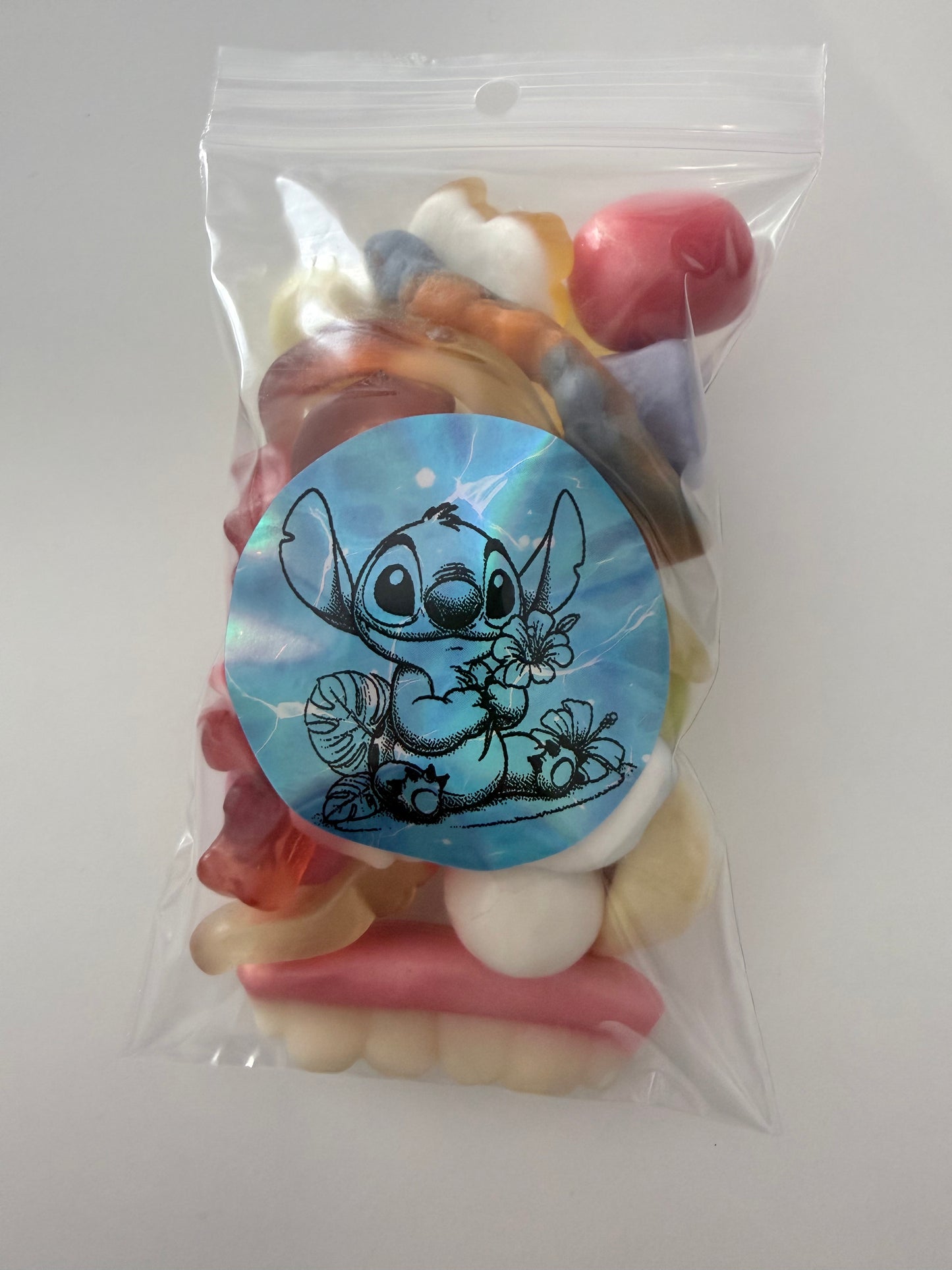 Sachet stitch bleu fleurs 100 gr bonbons mélange